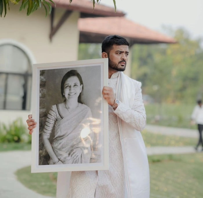 Monank Patel Holding His Mother's Photo