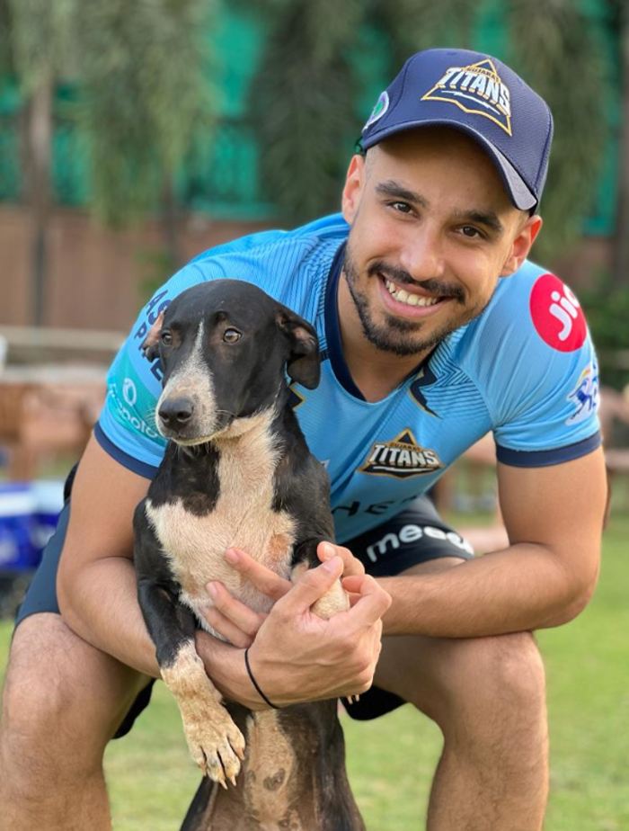 Abhinav Manohar Playing With A Dog During Gujarat Titans Practice Session